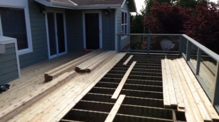 The Fun Part! New Cedar Decking Being applied to the existing deck frame