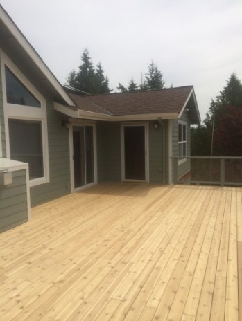 Cedar deck ready for stain New cedar decking fully installed