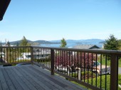 Cedar deck with cedar and aluminum railing. This deck is located in Anacortes WA 98221 and has a great view of Marches point and Cap Sante.
