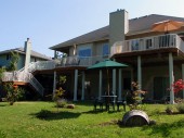 Addition to an existing deck with Timbertech DrySpace under-deck drainage system. Yellow cedar deck in Bellingham, WA.