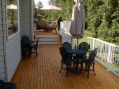Alaska Yellow Cedar decking (2x4) installed on a multi level deck with aluminum picket railings in Bellingham, WA 98226